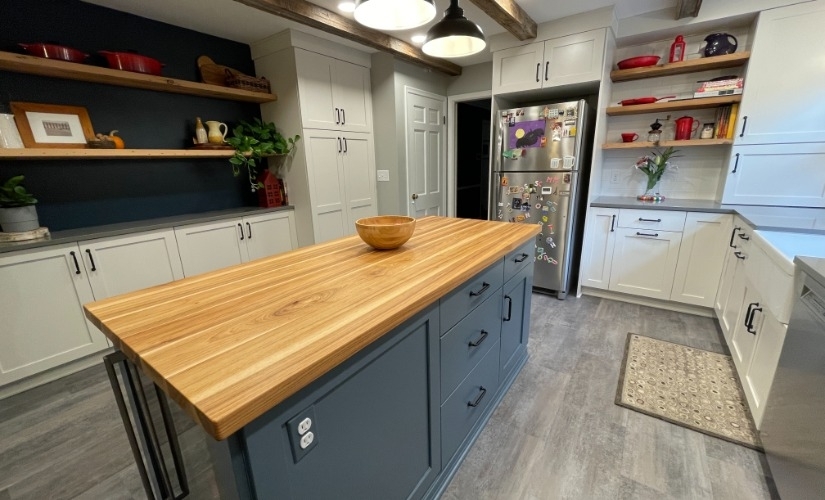 This kitchen located in Ann Arbor uses Brizo,DalTile,Reclaimed Michigan,Sherwin Williams,Showplace Cabinets,Solid Surfaces Unlimited,Top Knobs