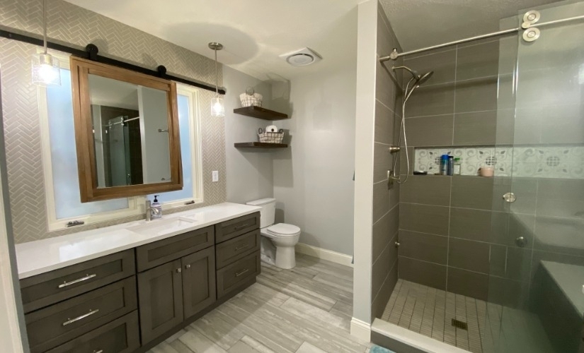 This bathroom located in Ann Arbor uses Atlas pulls,Capital Lighting,Cardinal,DalTile,Moen,Reclaimed Michigan,Sherwin Williams,Showplace Cabinets,Solid Surfaces Unlimited,Toto,Warmly Yours